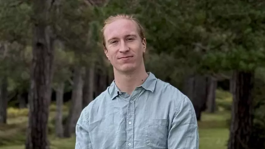 Guillaume stading in a forest